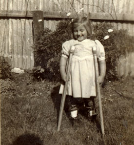 Edith with crutches and long braces